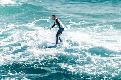 Full length of man standing in sea