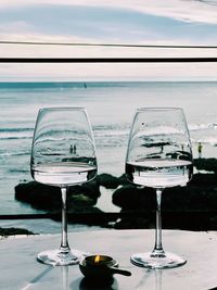 Two glasses of water at the beach