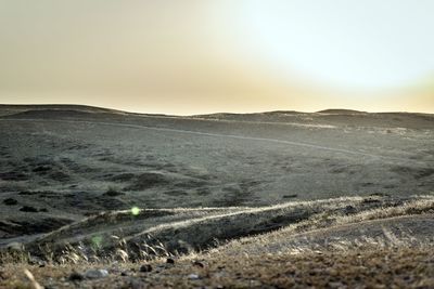 Scenic view of landscape against sky during sunset