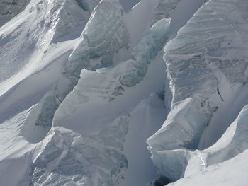 Full frame shot of glaciers on sunny day