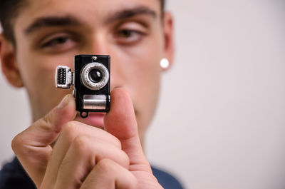 Close-up portrait of man photographing