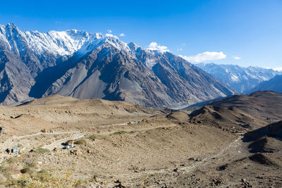 Scenic view of snowcapped mountains against sky