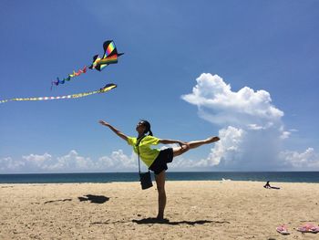 Full length of man flying over sea against sky