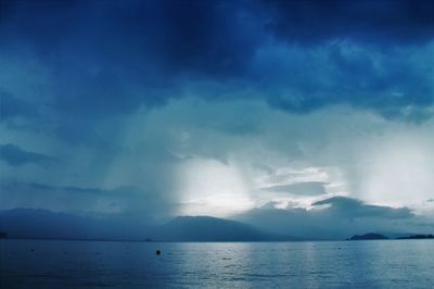 Scenic view of sea against cloudy sky