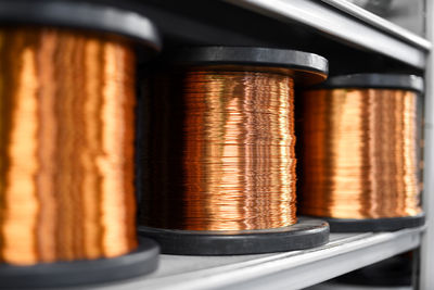 Close-up of copper wires on shelf