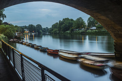 Boats moored in river