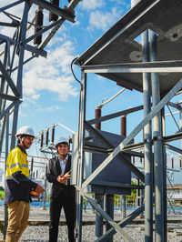 Men standing at construction site