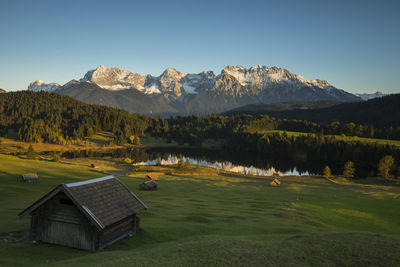 Scenic view of lake and mountains against sky