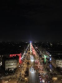 High angle view of city lit up at night