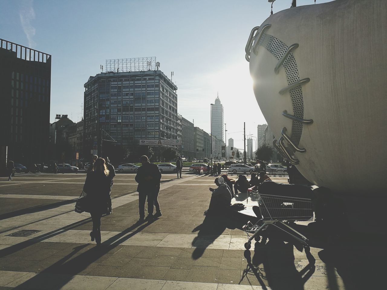 city, building exterior, architecture, built structure, outdoors, city life, real people, day, land vehicle, skyscraper, adults only, men, only men, bridge - man made structure, people, sky, one person, adult