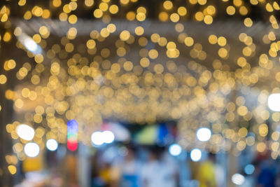 Defocused image of illuminated lights at night