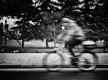 Blurred motion of people walking on road