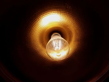 Low angle view of illuminated light bulb