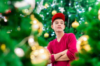 Portrait of man wearing hat standing outdoors