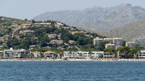 View of sea and buildings in city