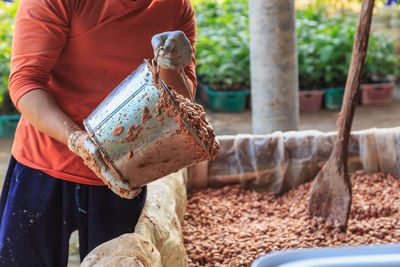 Man working on barbecue grill