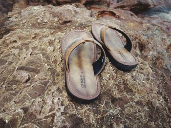 High angle view of shoes on rock