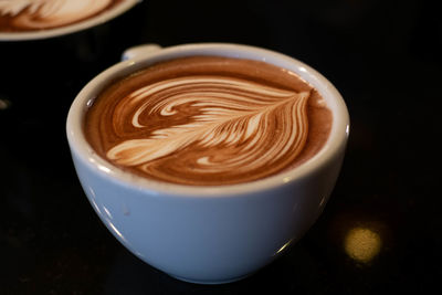 High angle view of cappuccino on table