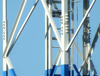 Low angle view of bridge against clear blue sky