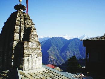 Temple against clear blue sky