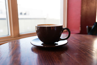 Close-up of coffee cup on table