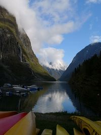 Scenic view of lake and mountains against sky