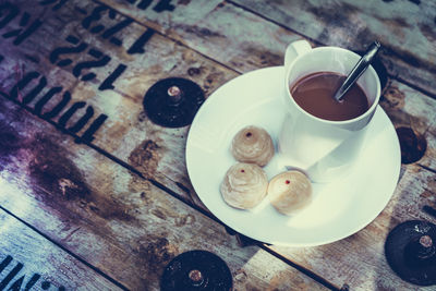 High angle view of coffee cup on table