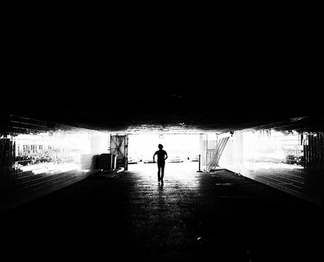walking, full length, indoors, rear view, silhouette, the way forward, built structure, men, architecture, lifestyles, tunnel, corridor, person, dark, unrecognizable person, day, walkway