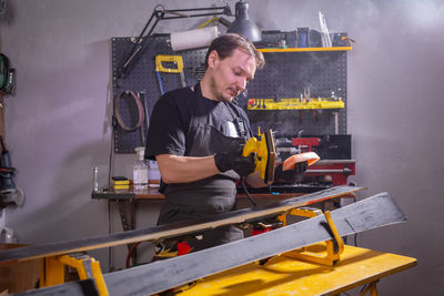 Man working on metal grate