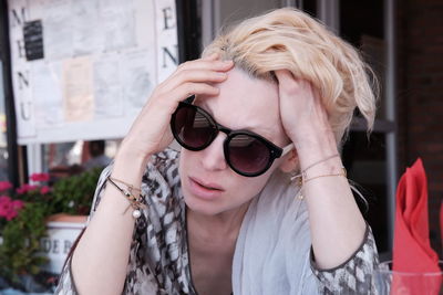 Close-up of young woman wearing sunglasses