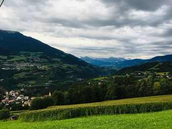 Scenic view of agricultural field against sky