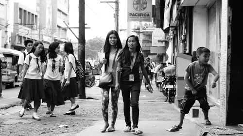 Full length of woman standing in city