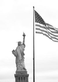 Low angle view of statue of liberty against sky