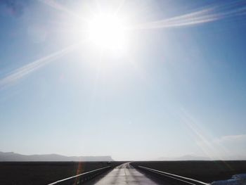 Road amidst landscape against sky