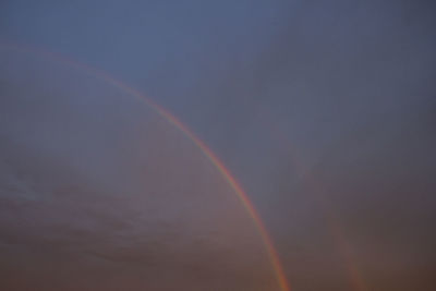Low angle view of rainbow against sky