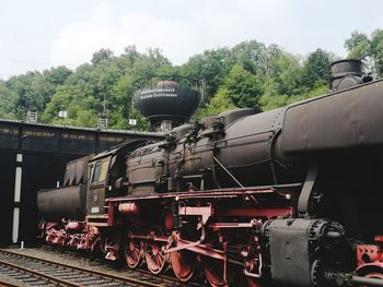 Train on railroad track against sky