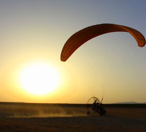 Scenic view of sunset over land