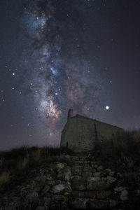 Milky way on ancient church with natural stairs in direction of sky near gallipoli in italy