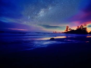 Scenic view of sea against sky at night