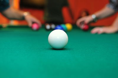 Close-up of pool ball on table