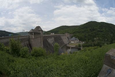 Built structure on landscape against sky