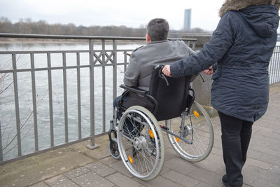 A physically disabled person on a wheelchair at a walk