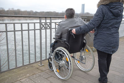 Rear view of man riding bicycle