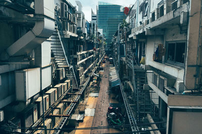 High angle view of railroad tracks amidst buildings in city