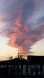 Scenic view of dramatic sky at sunset