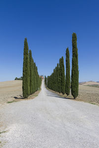 Panoramic view of road against clear blue sky