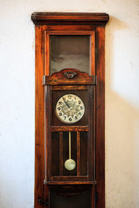 Close-up of clock on door