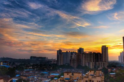 High angle view of buildings against sky during sunset