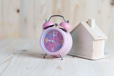 Close-up of clock on table