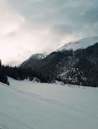 Snow covered mountain against sky